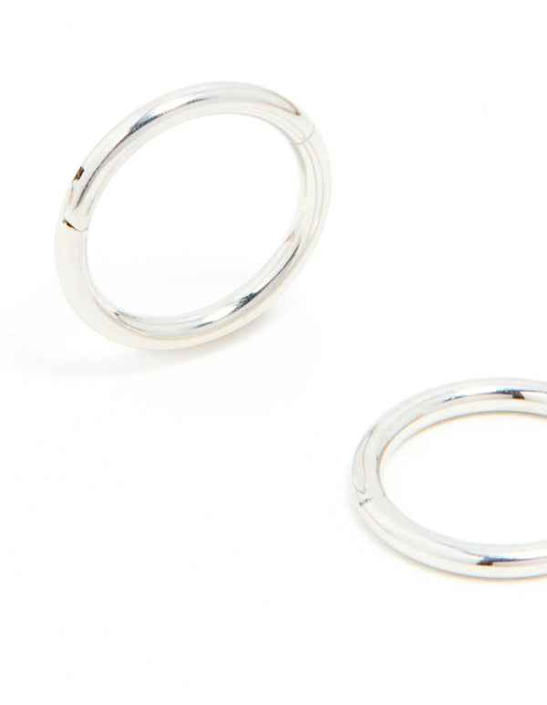 Showcasing surgical steel sleeper earrings in 7mm with dainty design and silver finish close up view