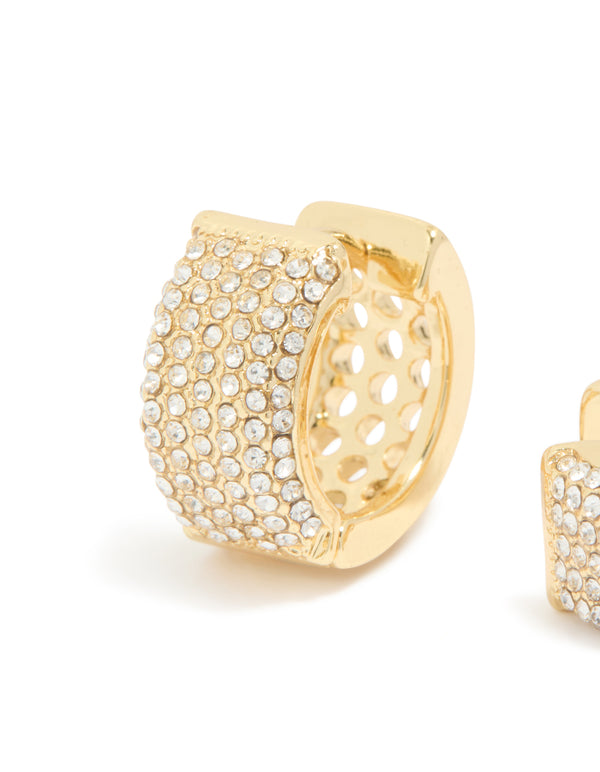 Showcasing gold plated diamante pavé medium huggie earrings with cubic zirconia detailing close up view