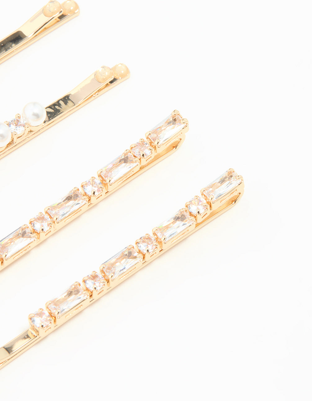 Showcasing gold cubic zirconia and pearl hair clips in a 6-pack detail view