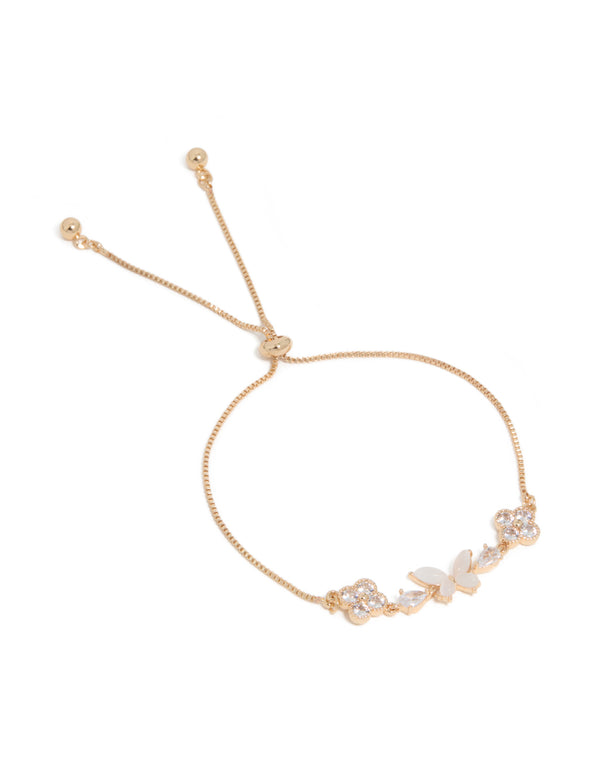 Featuring a gold cubic zirconia butterfly and flower toggle bracelet in white in front view