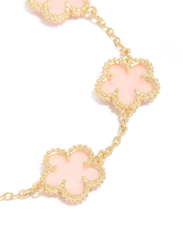Featuring gold plated pink flowers charm bracelet with dainty style close up view