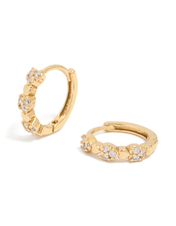 Beautifully crafted mini heart huggie earrings featuring cubic zirconia stones in gold plated finish front view