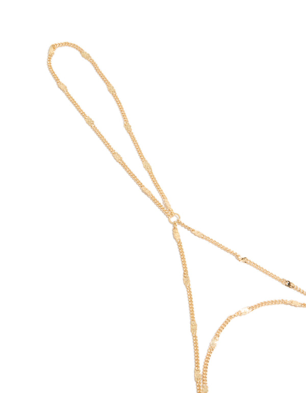 Elegant gold fine chain hand chain in a dainty design close up view
