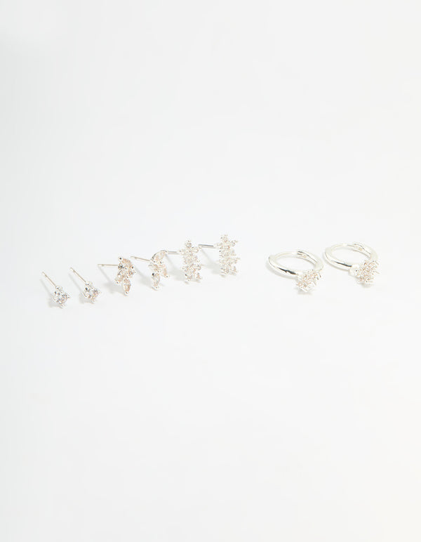 Showcasing a flower stud and hoop earrings 4-pack featuring floral patterns crafted from cubic zirconia, crystal, and silver plated brass with stud, huggie closures in white front view