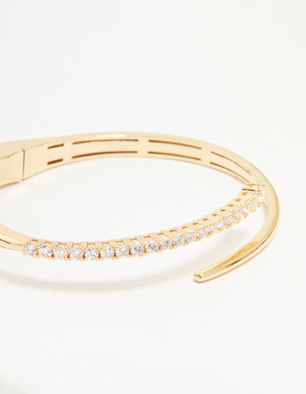Stunning gold diamante hinge bangle with round cut stones close up view