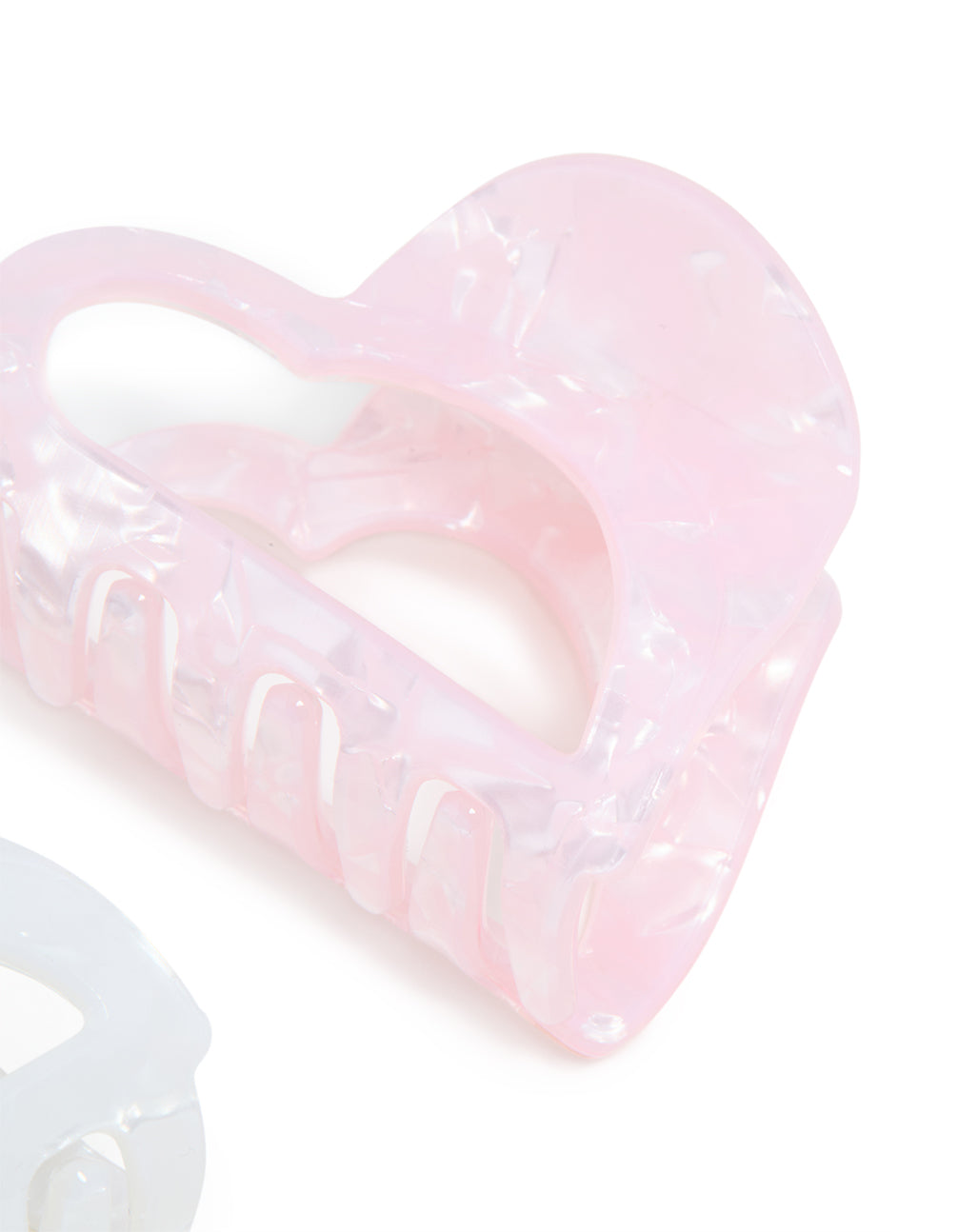 Crafted with heart shaped 2-pack pink and white acrylic small claw clips detail view