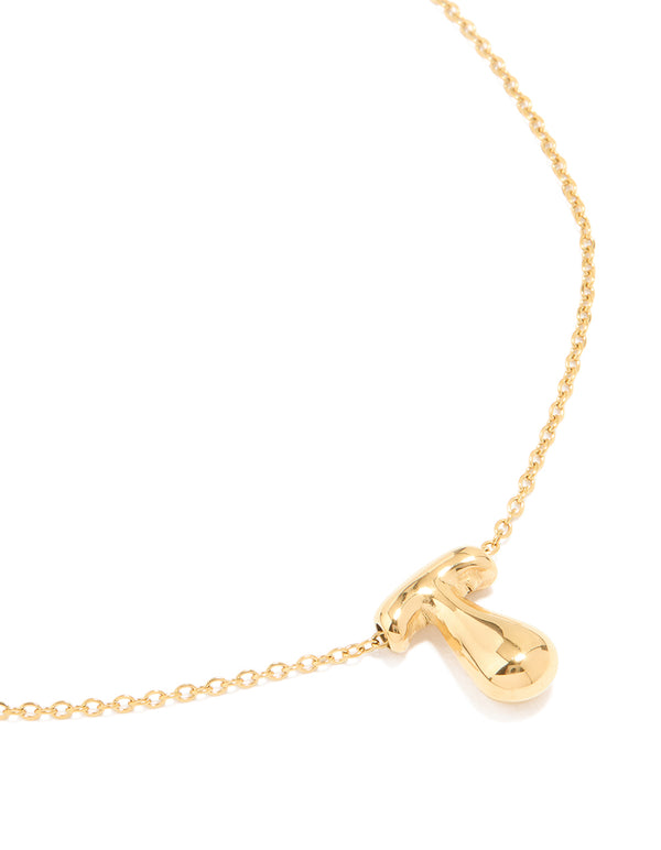 Showcasing a waterproof bubble letter T necklace crafted from gold plated stainless steel with initial pendant featuring dainty design close up view