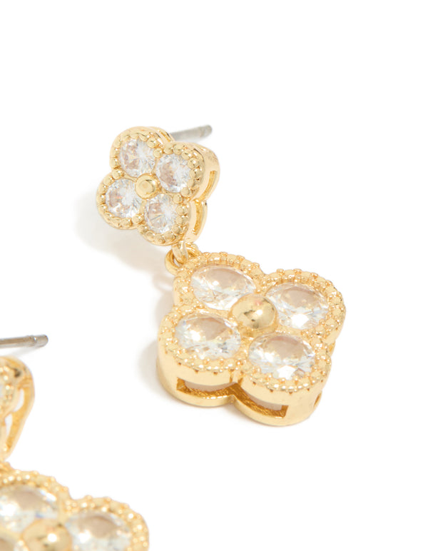 Showcasing a gold plated cubic zirconia small and medium flower earrings featuring a dainty clear stone design post detail view
