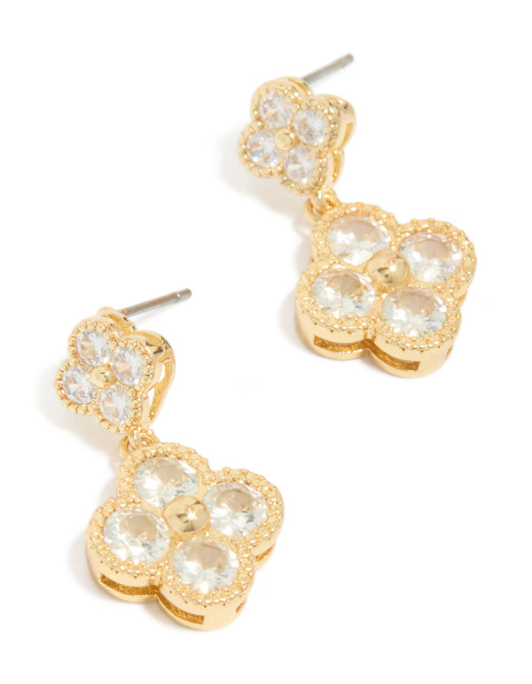 Crafted from gold plated metal, these cubic zirconia small and medium flower earrings feature dainty clear accents in front view.