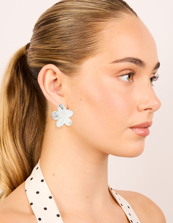 Elegant waterproof stainless steel textured flower stud earrings with floral pattern in silver finish on model view