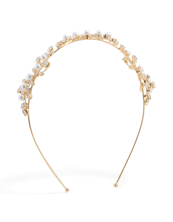 Showcasing a cubic zirconia vine and pearl headband in gold front view