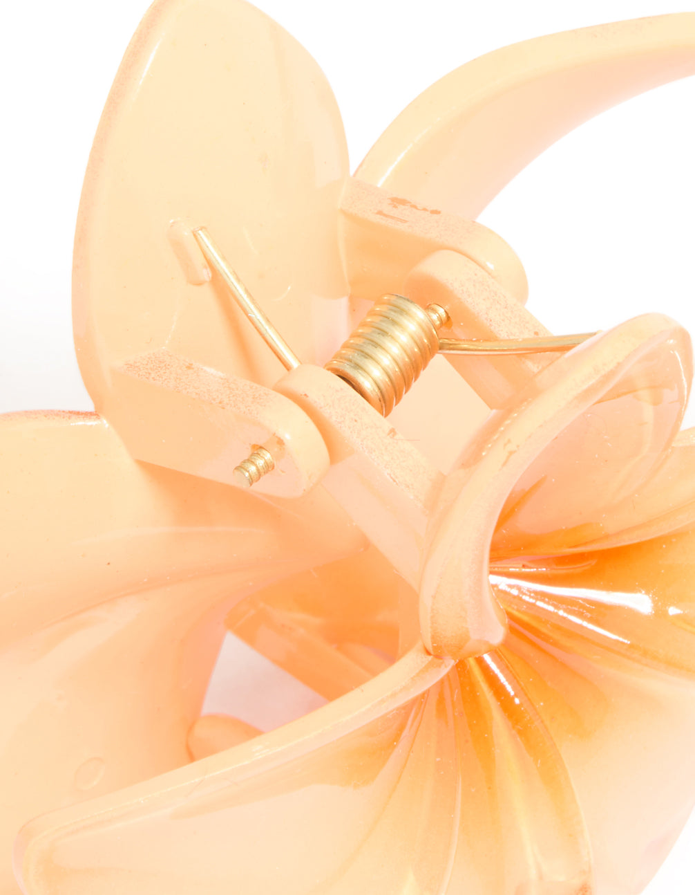 Designed with floral detail, the orange ombre frangipani flower claw clip in peachpuff reveals clasp mechanism detail view