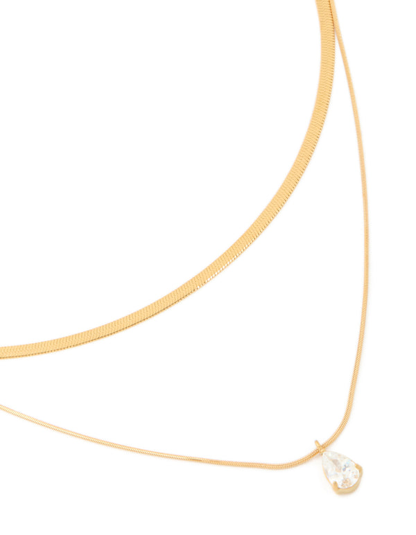 Showcasing a waterproof gold plated stainless steel cubic zirconia and snake chain layered necklace in gold front view