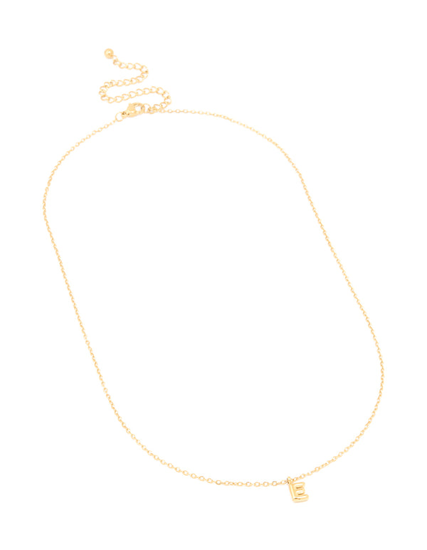 Highlighting a waterproof gold plated stainless steel mini bubble letter E pendant initial necklace in dainty style close up view