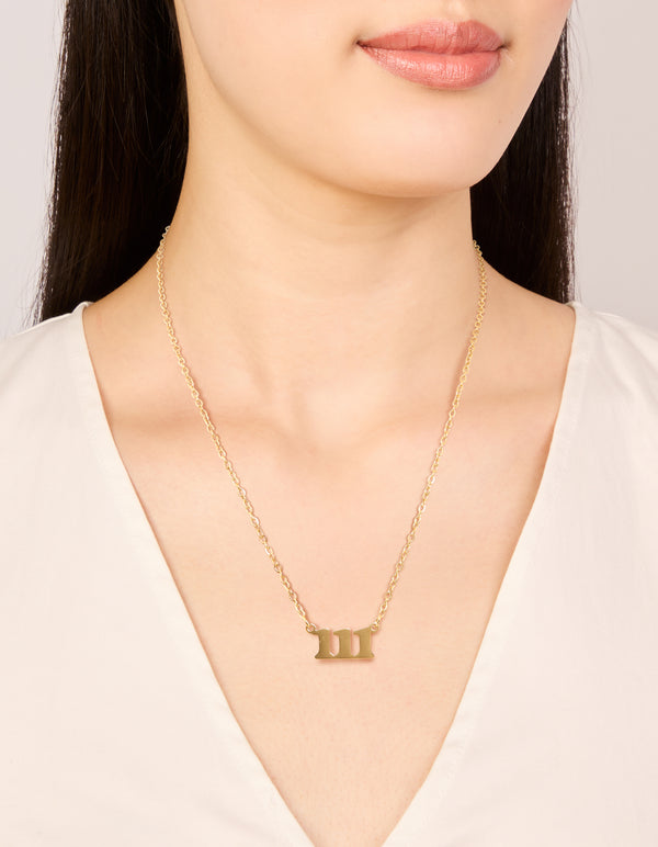 Featuring a waterproof gold plated stainless steel angel number 111 necklace with numbers and dainty design on neck view