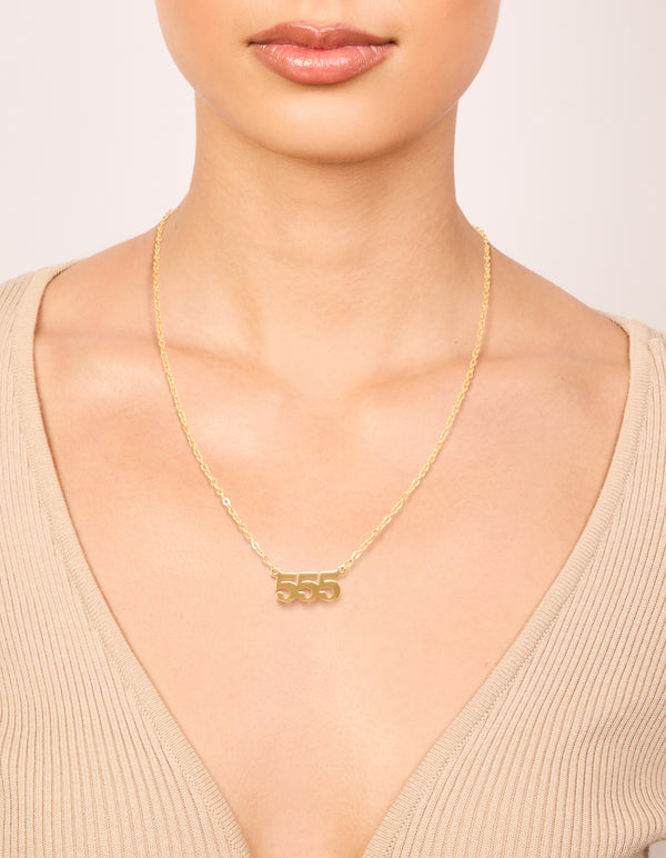Showcasing angel number 555 necklace in waterproof gold plated stainless steel with numbers feature on neck view