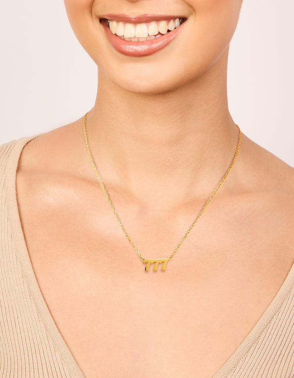 Discover dainty style waterproof gold plated stainless steel angel number 777 necklace featuring numbers on neck view