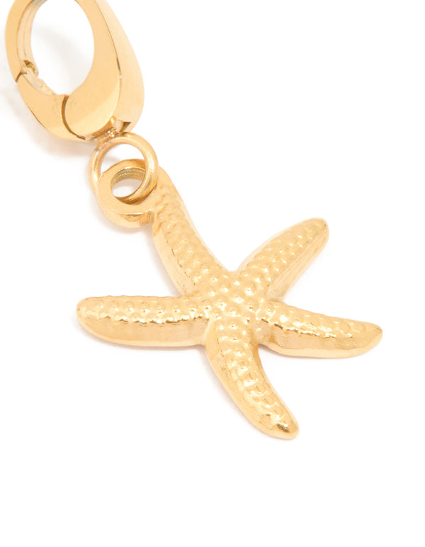 A starfish charm in gold featuring ocean-inspired texture and lobster clasp close up view