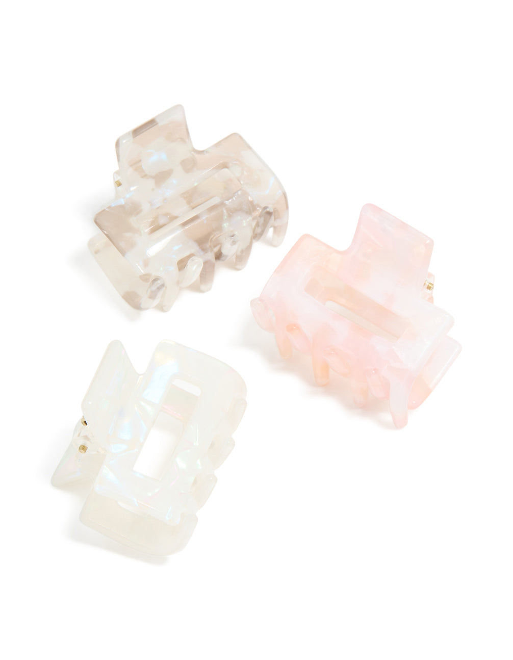 Showcasing solid acrylic mini rectangle claw clips in a 3-pack featuring light pink, beige, and ivory front view