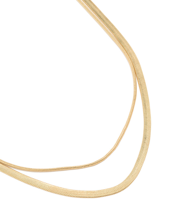 Discover a gold plated fine and snake chain layered necklace front view