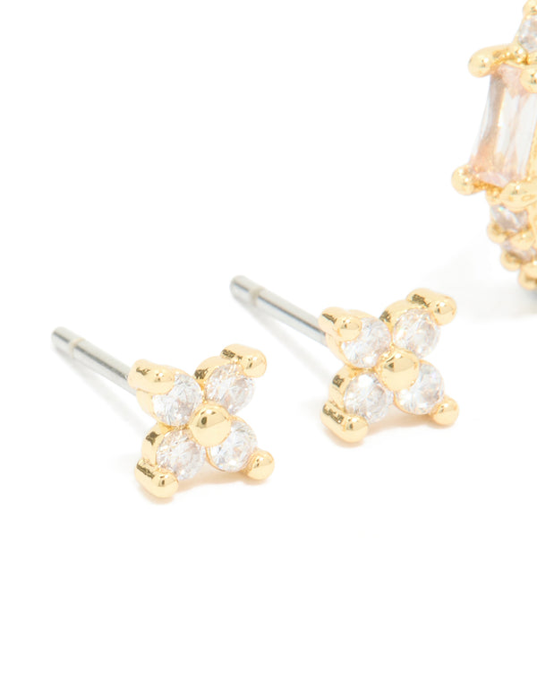 Highlighting gold plated cubic zirconia star huggie and hoop earrings in a 2-pack with crystal clear design close up view