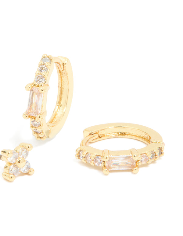 Displaying gold plated cubic zirconia star huggie and hoop earrings in a 2-pack with celestial crystal clear design post detail view