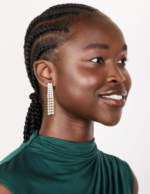 Presenting silver cubic zirconia half cup chain drop earrings with clear stones on model view
