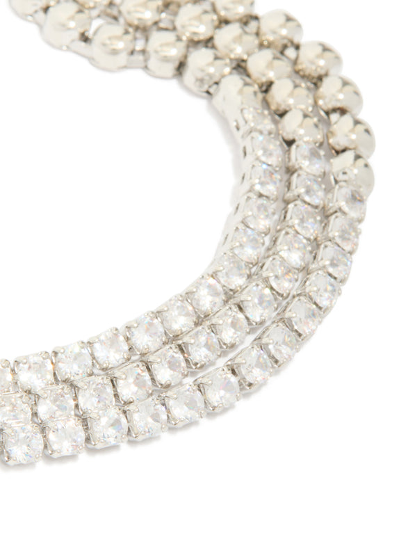 Discover this silver cubic zirconia half cup chain layered bracelet close up view