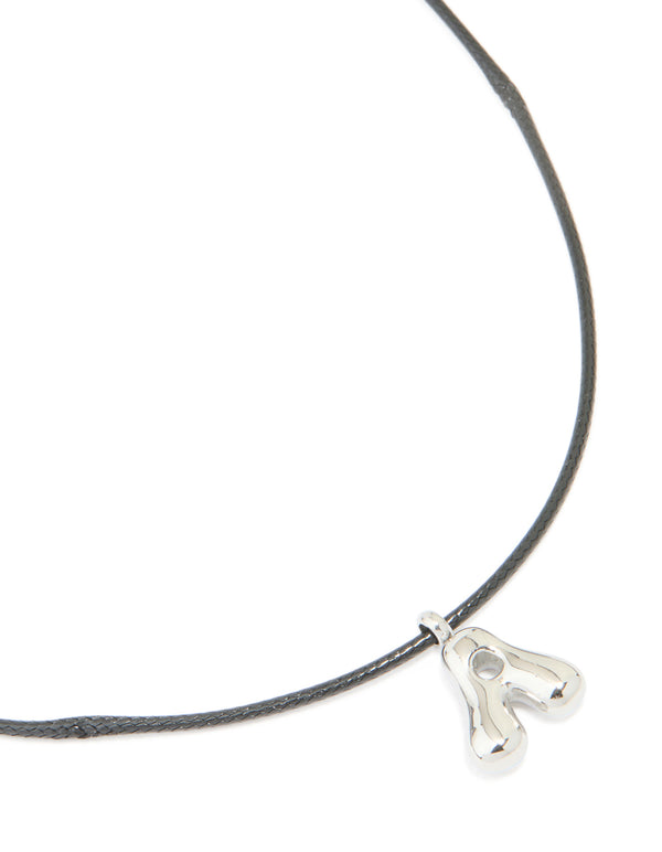 Showcasing a waterproof initial feature necklace with a large bubble letter A pendant crafted from stainless steel on grey cord close up view