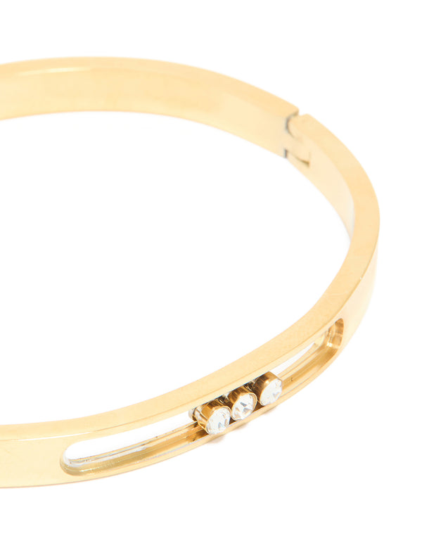 Crafted from waterproof gold plated stainless steel, this diamante hinged bangle features white crystal embellishments close up view