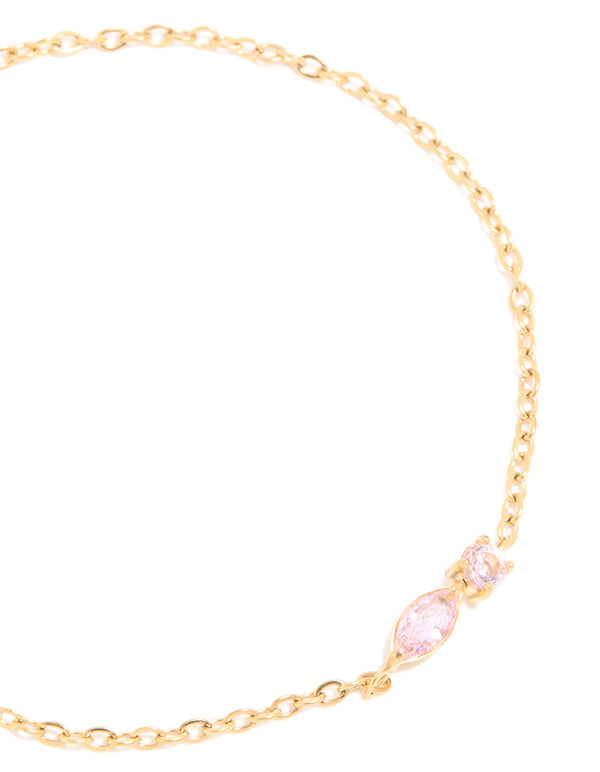 Crafted from waterproof gold plated stainless steel with pink cubic zirconia bracelet close up view