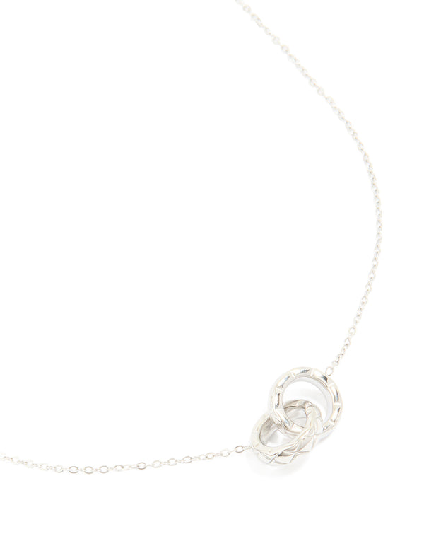 Showcasing a waterproof stainless steel textured linked circles pendant necklace in silver with dainty styling close up view