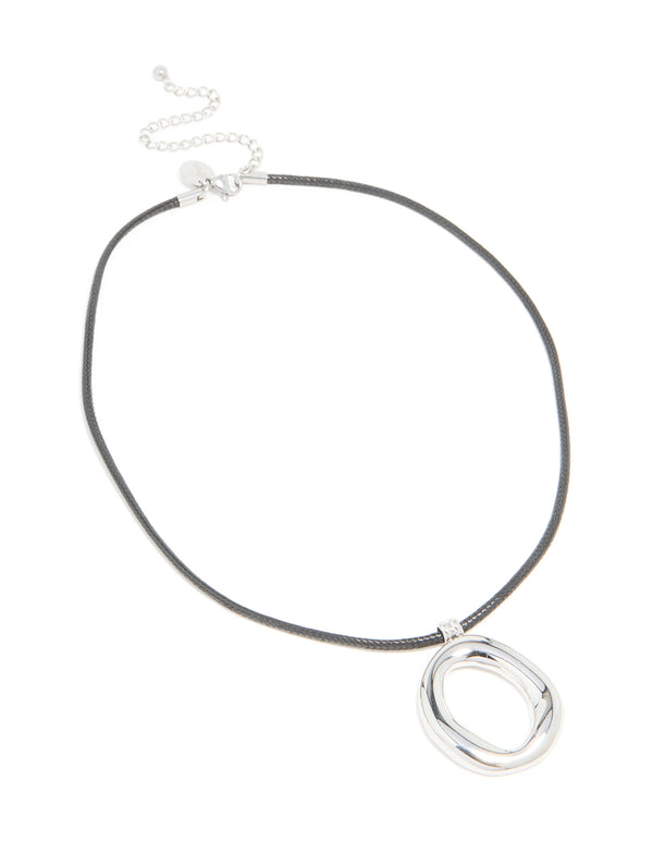 Crafted from waterproof stainless steel with an organic pendant on a black cord necklace front view