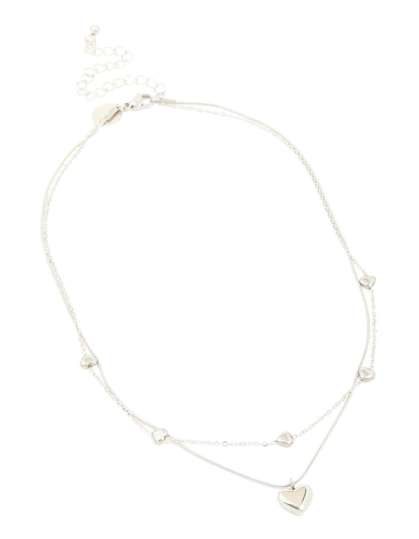This waterproof stainless steel multi heart charm layered necklace in silver offers a front view
