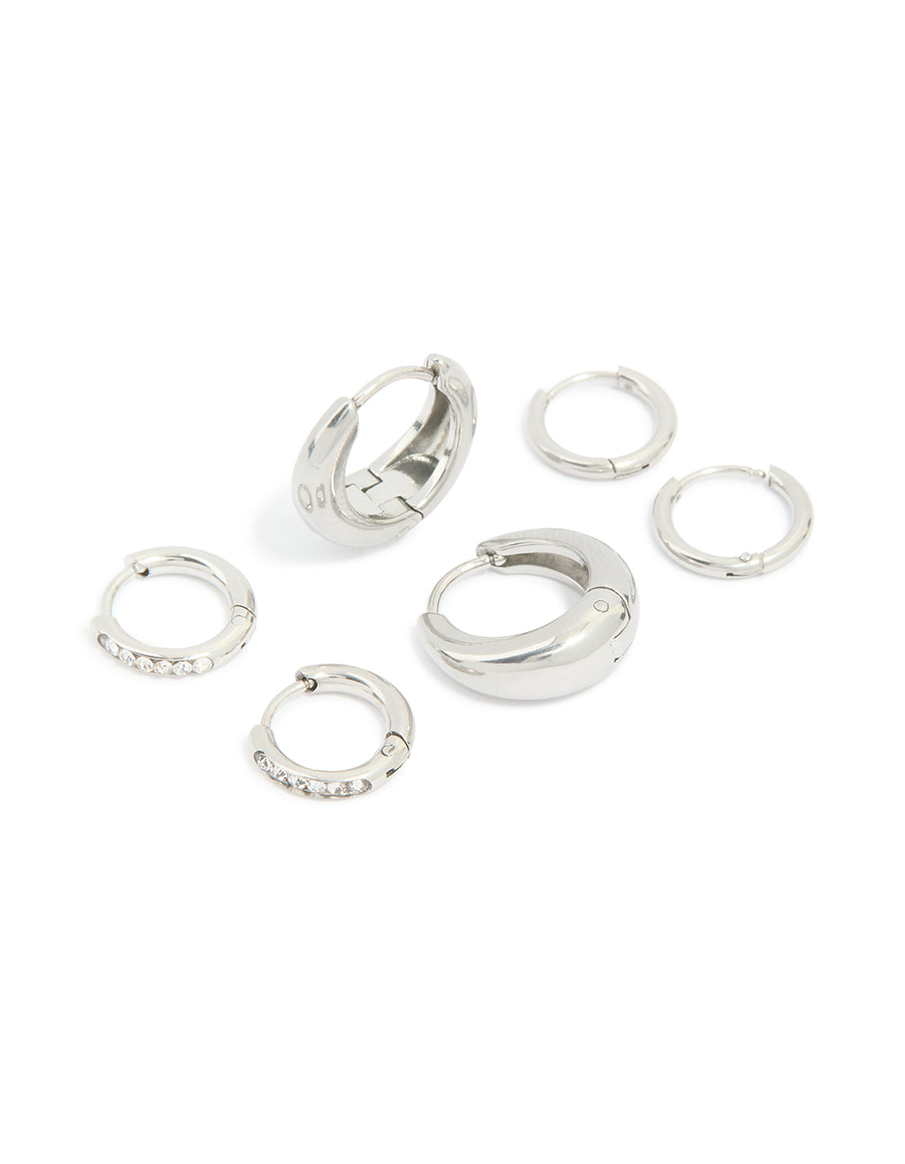 Presenting a waterproof stainless steel cubic zirconia mix huggie earrings 3-pack with silver finish and clear tones front view
