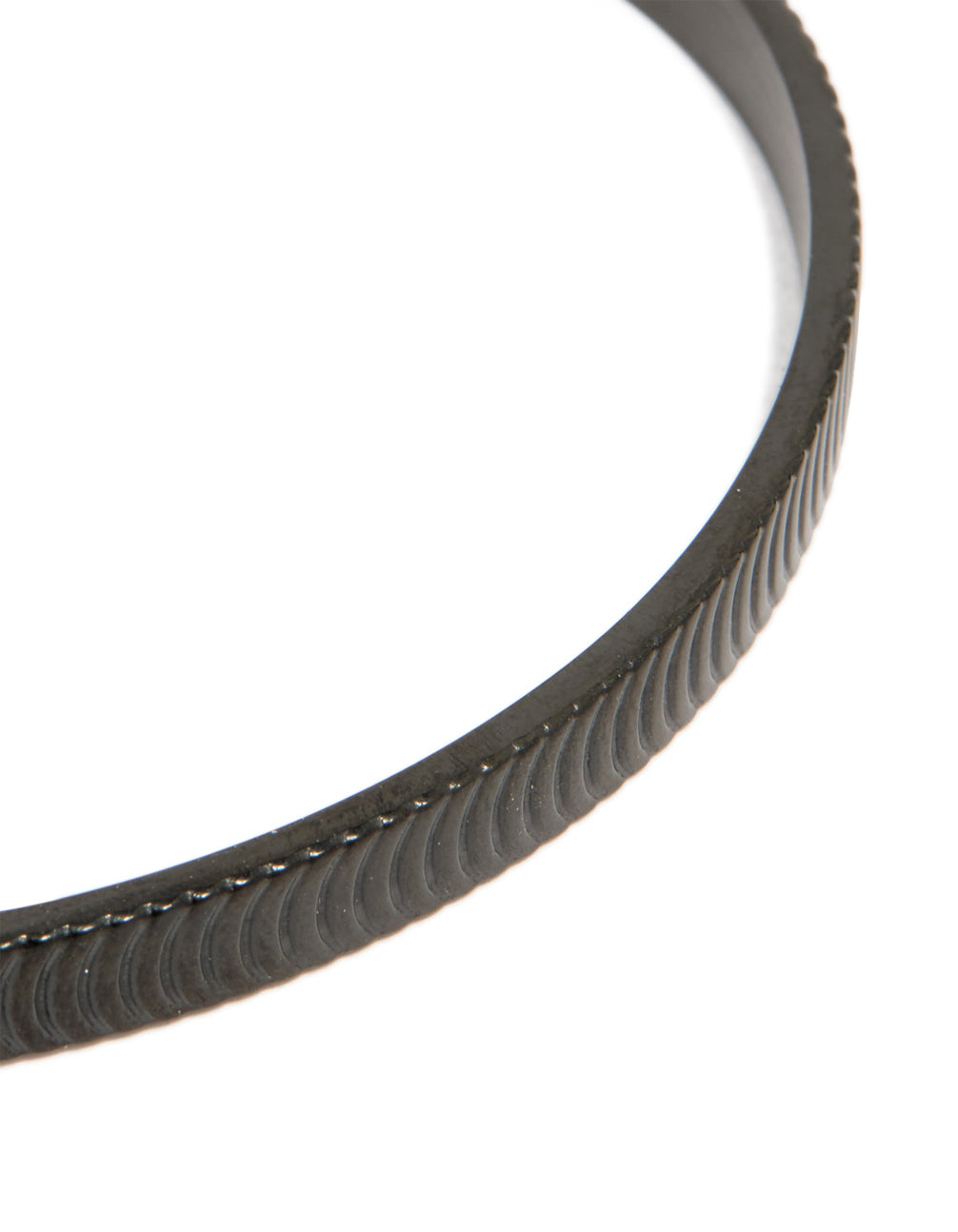 Highlighting a mens waterproof black stainless steel detailed wrist cuff close up view