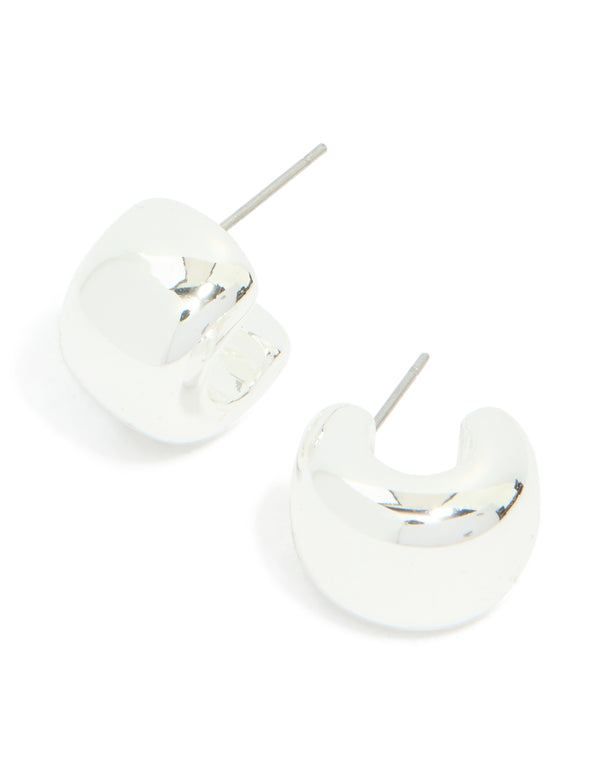 Showcasing chunky hoop huggie earrings in silver front view
