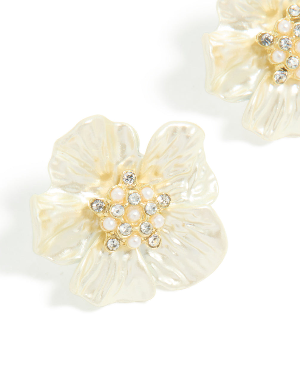 Highlighting statement flower earrings in gold plated finish with pearl and diamante embellished center close up view