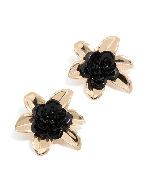 Discover statement stud earrings featuring beaded floral design with black center in gold front view