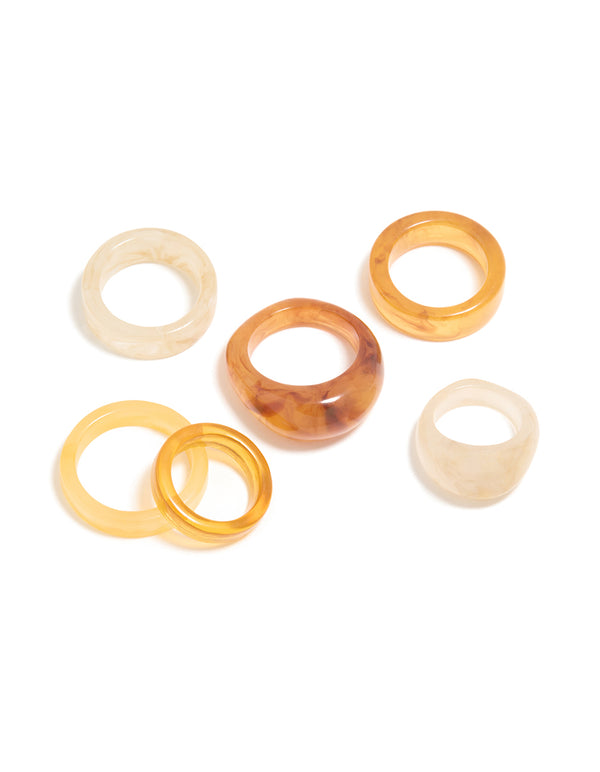 Featuring chunky statement rings in marble pattern with wheat brown gold and beige tones, acrylic cigar bubble 6-pack front view