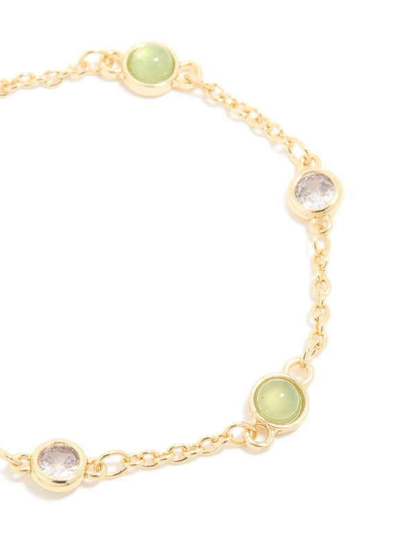 Highlighting a gold plated green aventurine bracelet with cubic zirconia in close up view