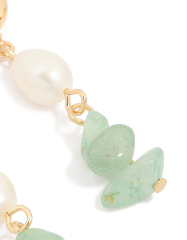 Close perspective of pale green jade with freshwater pearl connection in statement drop earrings post detail view
