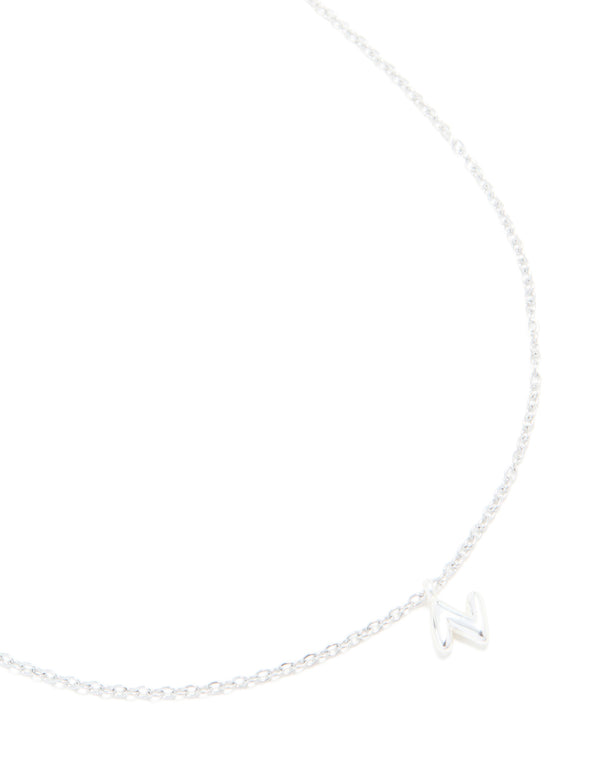 Showcasing a waterproof stainless steel mini bubble letter N necklace with initial pendant in silver close up view