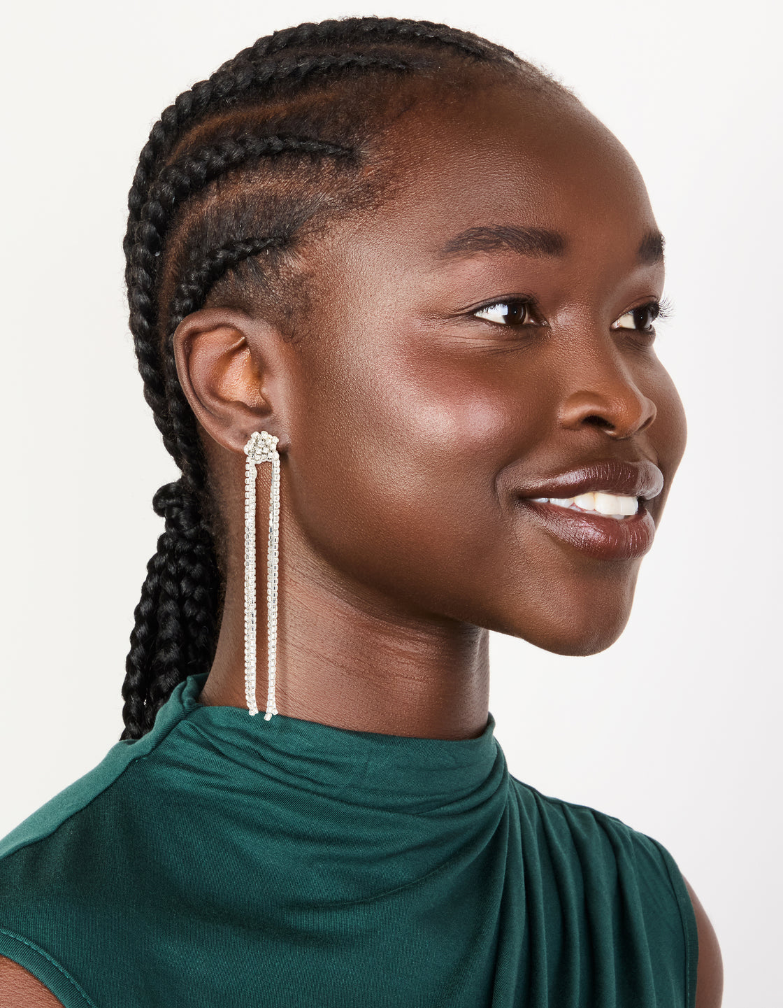 Crafted from silver, these diamante knotted tassel drop earrings feature statement styling on model view