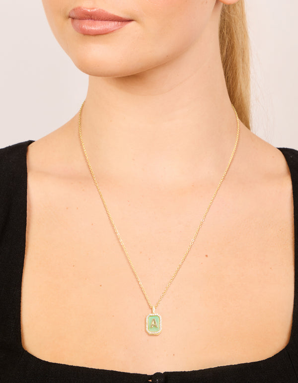 Beautifully designed gold plated brass cubic zirconia letter A tag necklace featuring initials pendant on neck view