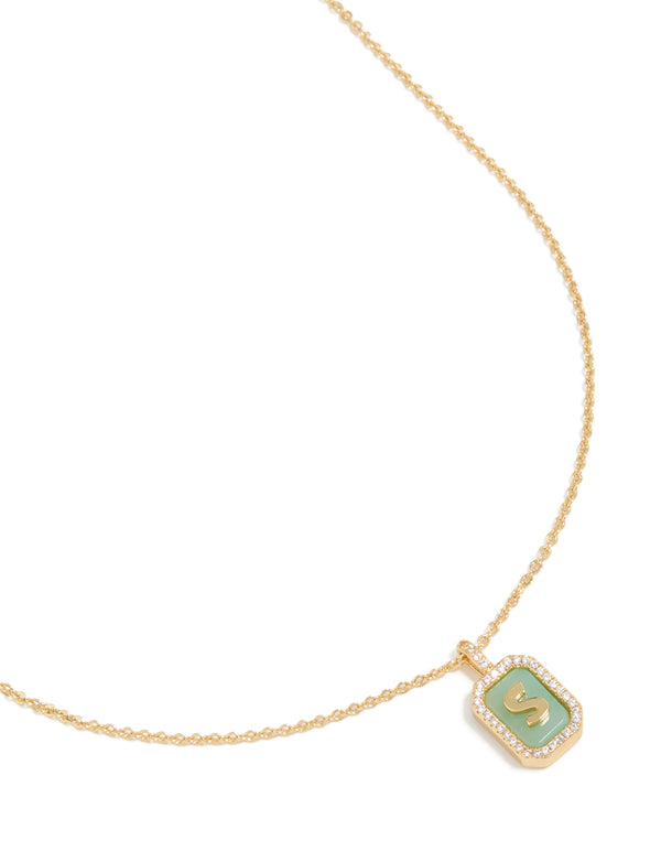 Featuring a gold plated brass cubic zirconia letter S tag necklace with initials pendant close up view