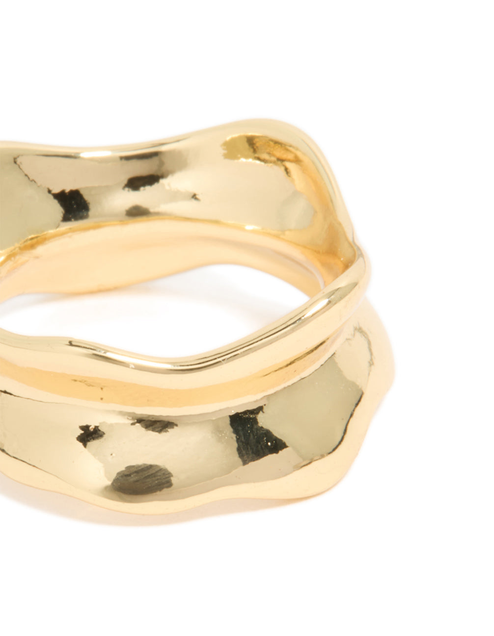 Highlighting a gold plated modern curved molten ring close up view