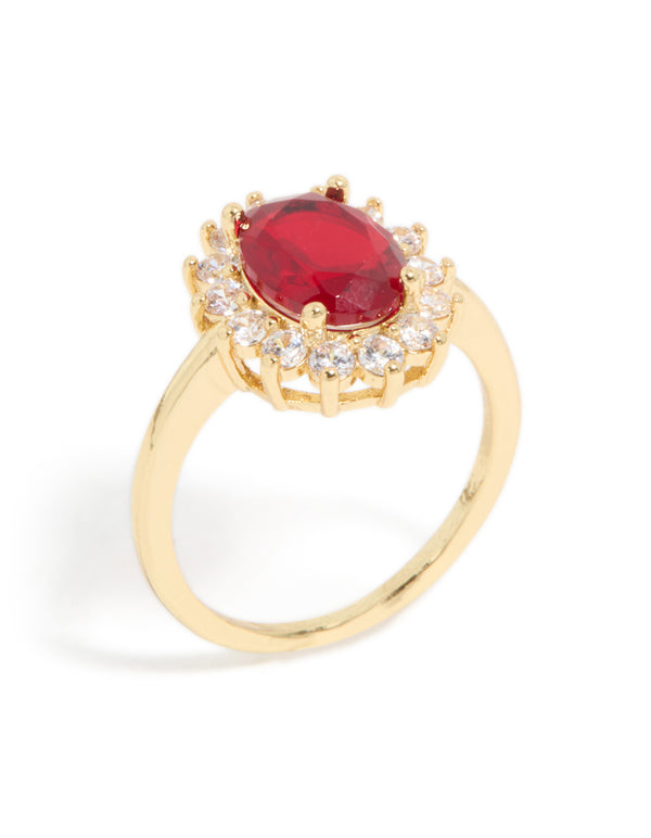 Expertly designed gold plated oval red cubic zirconia ring featuring halo and statement styling side detail view