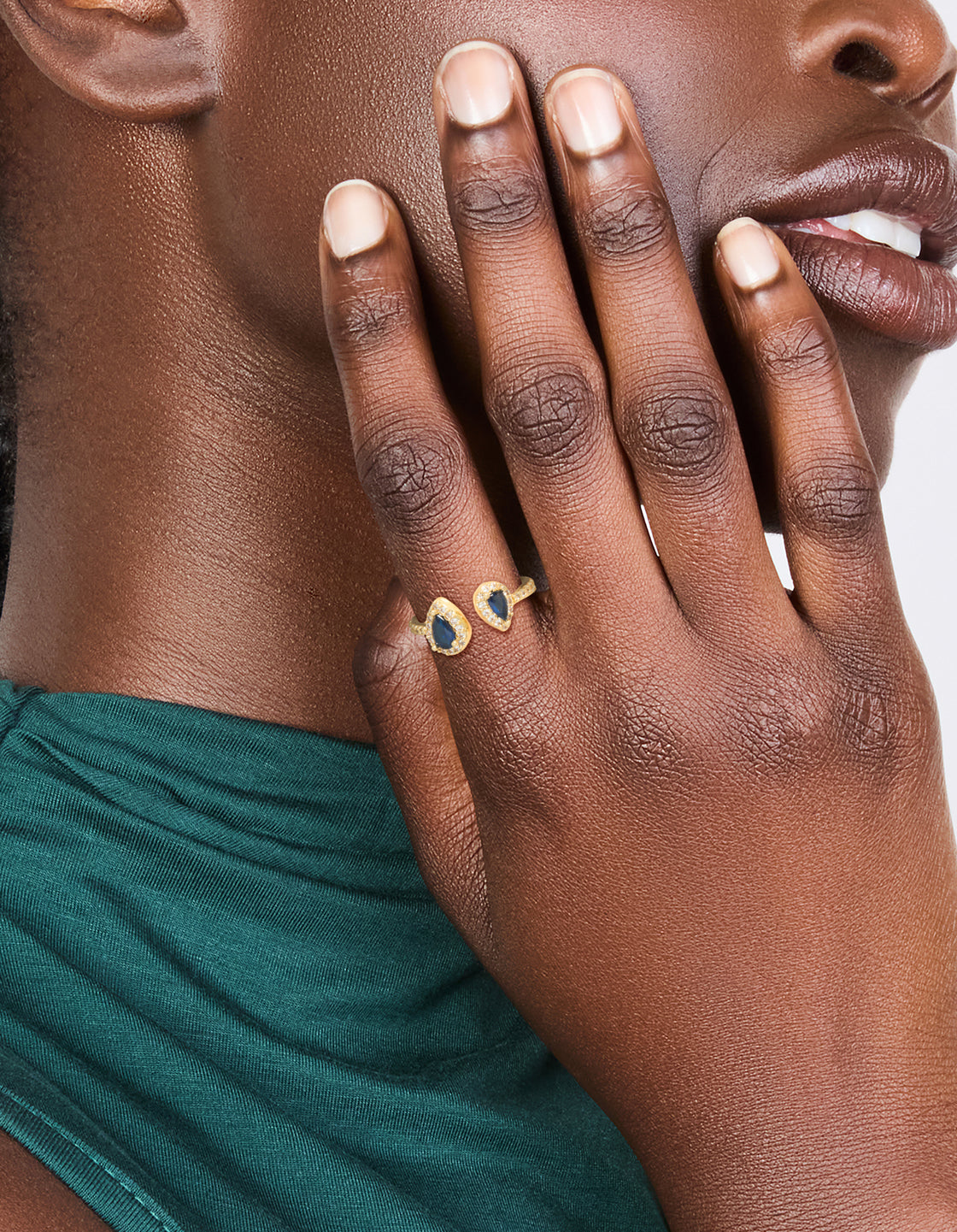 Featuring a gold plated blue diamante duo ring with statement design on finger view