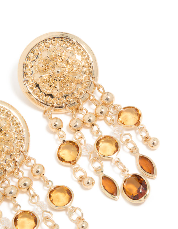 A detailed view of gold brown diamante festival dangle drop earrings with floral design, balls, charms statement style post detail view